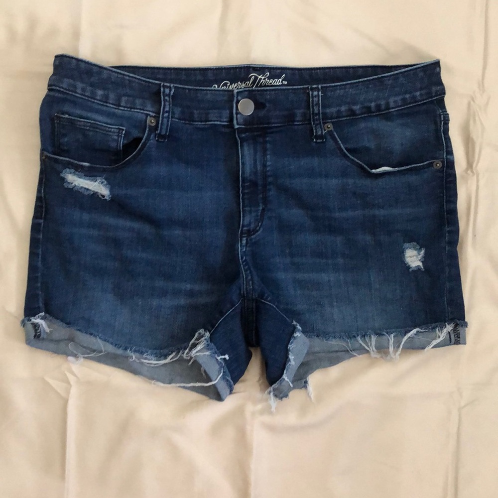 cuffed cut off jean shorts with distressed patches